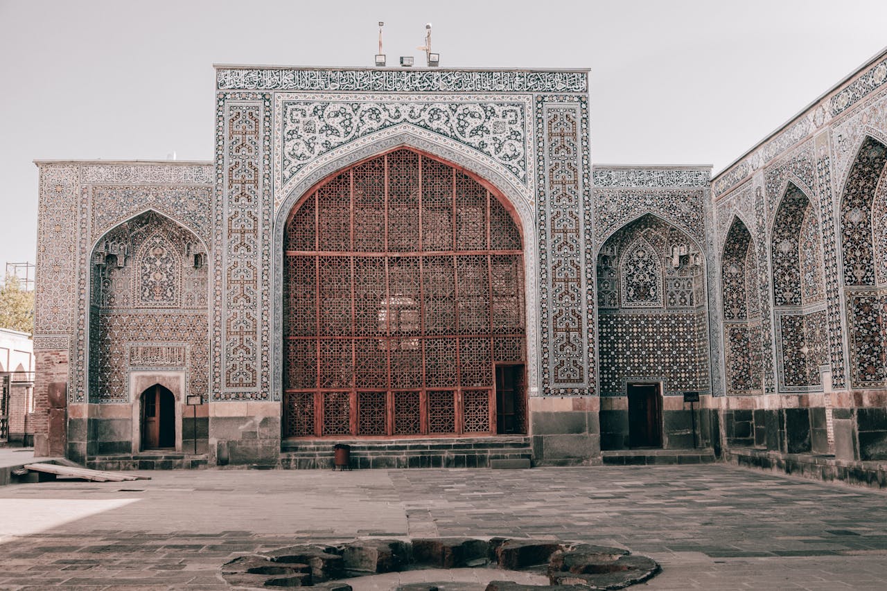 about-us-01 Explore the intricate details of Persian Islamic architecture in this historic Iranian landmark image.
